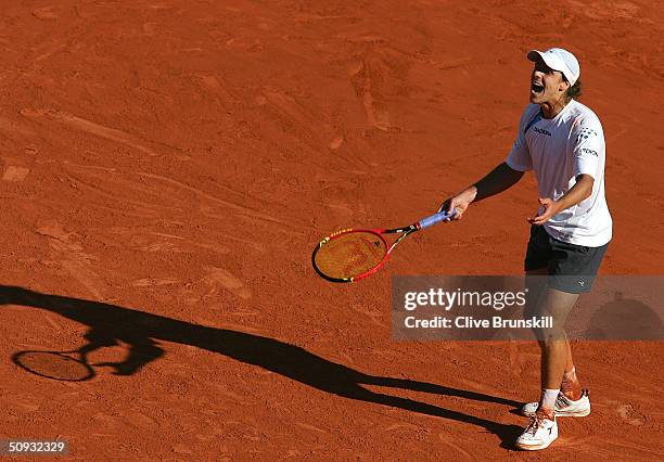 Gaston Gaudio of Argentina celebrates after winning his men's final match against Guillermo Coria of Argentina during Day Fourteen of the 2004 French...