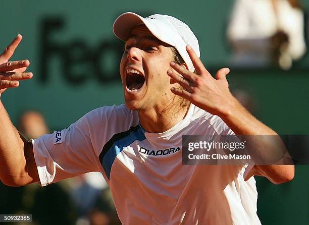 Gaston Gaudio of Argentina celebrates after winning his men's final match against Guillermo Coria of Argentina during Day Fourteen of the 2004 French...