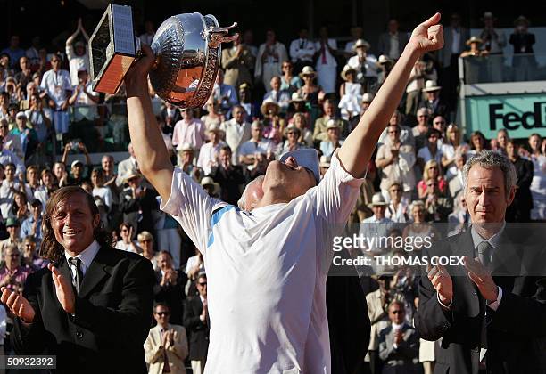Argentinian Gaston Gaudio celebrates after defeating Argentinian Guillermo Coria in their men's final match during the French Open at Roland Garros...