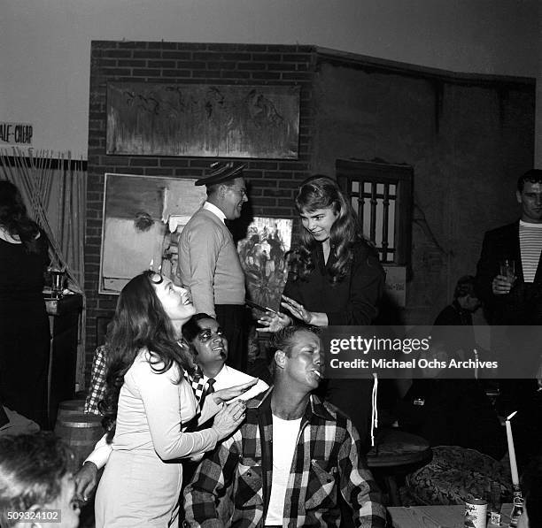 Actor Gene Nelson plays the bongos at Pandora's Coffee House on Sunset Boulevard in Los Angeles,California. Gene Nelson