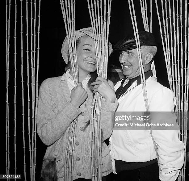 Actress Nina Foch and producer Albert McCleery pose at Pandora's Coffee House on Sunset Boulevard in Los Angeles,California.