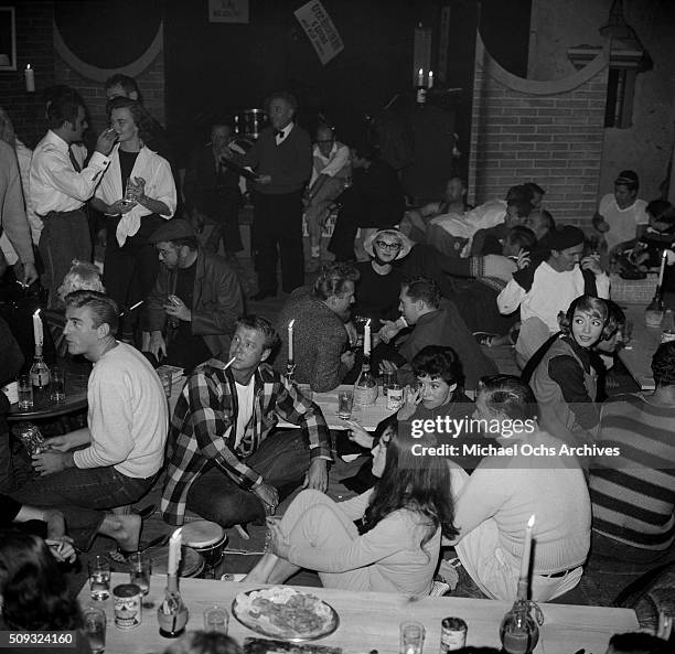 Actress Barbara Ainslee and actor Bob Sampson and Gene Nelson at Pandora's Coffee House on Sunset Boulevard in Los Angeles,California."n "nBarbara...
