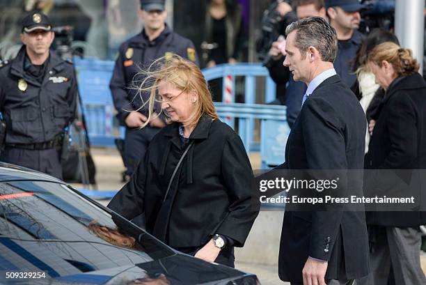 Princess Cristina de Borbon and her husband Inaki Urdangarin leave the courtroom at the Balearic School of Public Administration for summary...