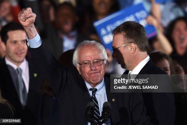 Democratic presidential candidate Bernie Sanders celebrates his victory during the primary night rally in Concord, New Hampshire, on February 9,...
