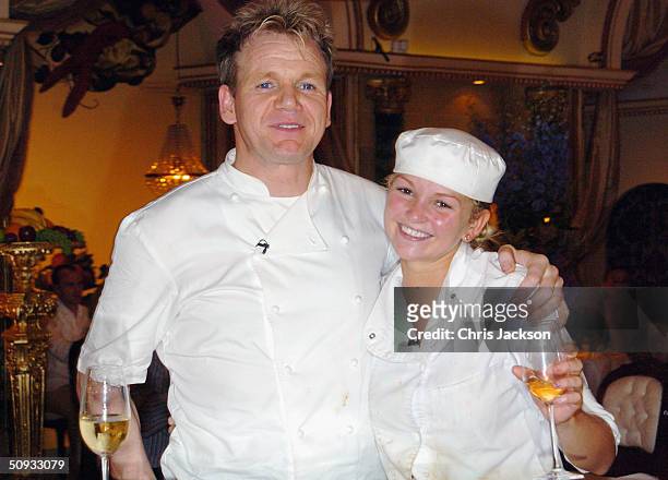 Gordon Ramsay poses for the cameras with Jennifer Ellison winner of reality television program "Hell's Kitchen" at Brick Lane on June 6, 2004 in...