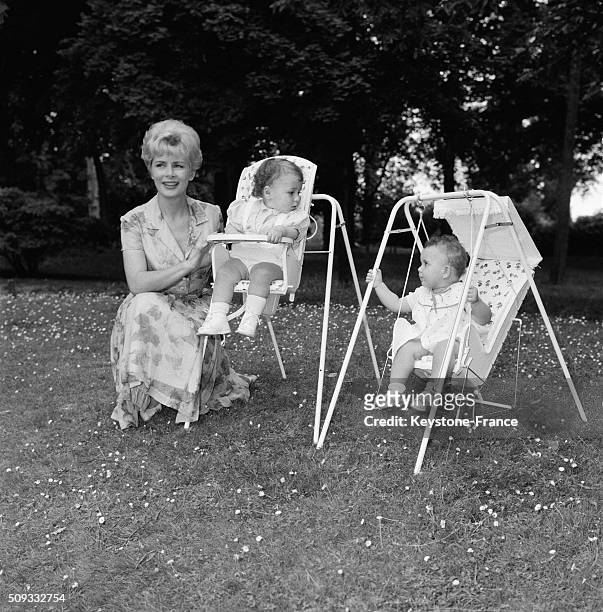 Presenter Jacqueline Huet With Babies Seated In The New Baby Chair Called 'Baby Relax', in France, on June 22, 1962.
