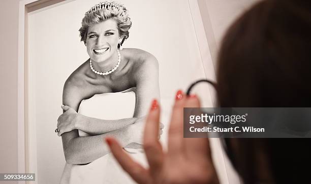 An image of Princess Diana is inspected at the press preview for 'Vogue 100: A Century of Style' exhibiting the photographs that has been...