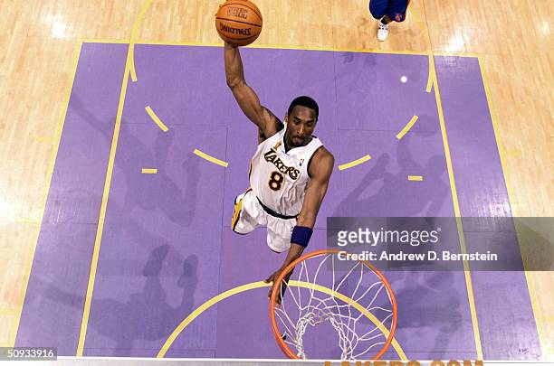Kobe Bryant of the Los Angeles Lakers goes for a dunk against the Detroit Pistons during game one of the 2004 NBA Finals June 6, 2004 at the Staples...