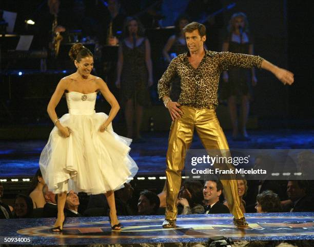 Actor Hugh Jackman, Sarah Jessica Parker and the cast of "The Boy from OZ" perform on stage during the "58th Annual Tony Awards" at Radio City Music...