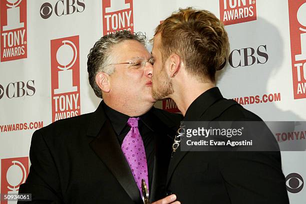 Actor Harvey Fienstein and Tony Award winner Jeff Whitty kiss as they attend the "58th Annual Tony Awards" at Radio City Music Hall on June 6, 2004...
