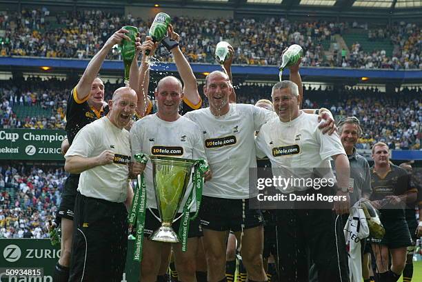 Left to Right: Shaun Edwards, Alex King, Lawrence Dallaglio and Coach Warren Gatland of Wasps are drenched in beer by their teamates after the...