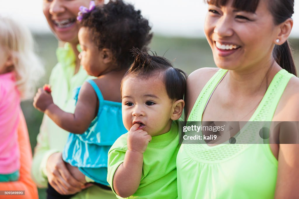 Multi-racial moms and babies, focus on Asian boy