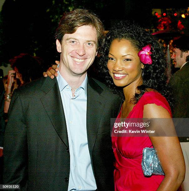 Actress Garcelle Beauvais-Nilon and her husband Mike Nilon pose at the after-party for Paramount's "The Stepford Wives" at the Armand Hammer Museum...