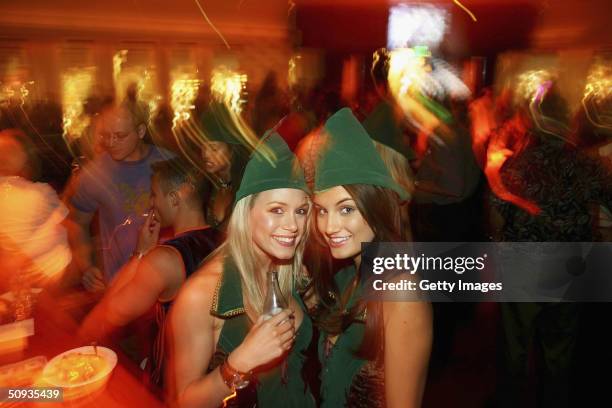 Best Agency models Rachelle Leah and Andrea Tiede pose in a festive lounge, on June 5, 2004 in Las Vegas, Nevada.