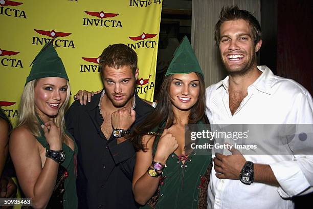 Actors from "7th Heaven" George and Geoff Stults show off the new Invicta line with models Rachelle Leah and Andrea Tiede , on June 5, 2004 in Las...