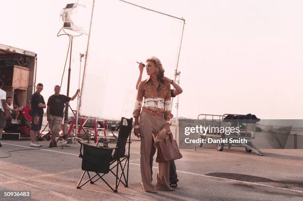 Singer/actress Madonna gets make up on the set during filming of 'Swept Away' on October 27, 2001 in Sardinia, Italy.