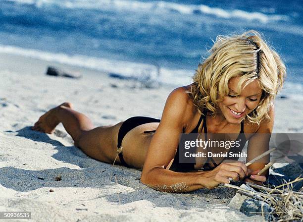 Singer/Actress Madonna lies on the beach during filming of 'Swept Away' on October 27, 2001 in Sardinia, Italy.