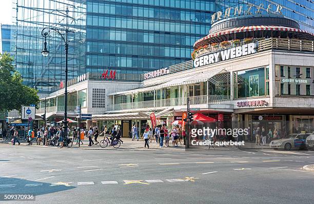 people passing the shopping mall kranzler eck in berlin - kurfürstendamm stock pictures, royalty-free photos & images
