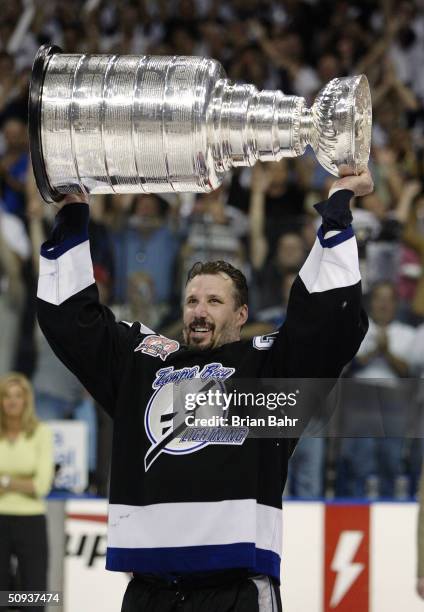 Dave Andreychuk of the Tampa Bay Lightning skates with the Stanley Cup after defeating the Calgary Flames in game seven of the NHL Stanley Cup Finals...