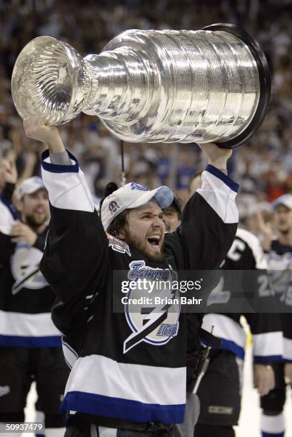 Martin St. Louis of the Tampa Bay Lightning skates with the Stanley Cup after defeating the Calgary Flames in game seven of the NHL Stanley Cup...