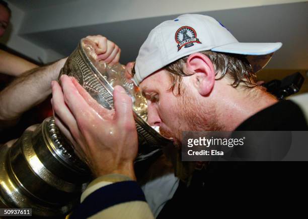 Brad Richards of the Tampa Bay Lightning drinks beer out of the Stanley Cup in the locker room after defeating the Calgary Flames in game seven of...