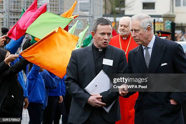 Prince Charles, Prince of Wales walks with the Reverend Mark Poulson during a visit to St John's Church on February 10, 2016 in Southall, England....