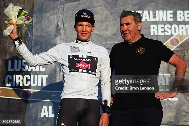 Soren Kragh Andersen of Denmark and Team Giant-Alpecin stands on the podium with Eddy Merckx of Belgium while leading the young jersey competition...