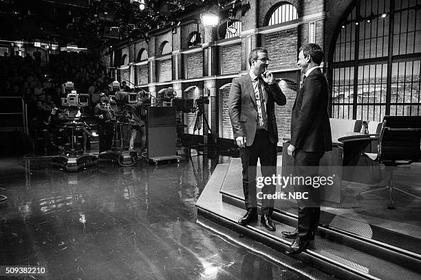 Episode 324 -- Pictured: Comedian John Oliver talks with host Seth Meyers during a commerical break on February 9, 2016 --