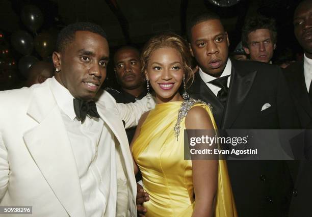 Sean "P. Diddy" Combs and singers Beyonce Knowles and Jay-Z attend the Sean Jean/Zac Posen CFDA after-party at Marquee, on June 7, 2004 in New York...