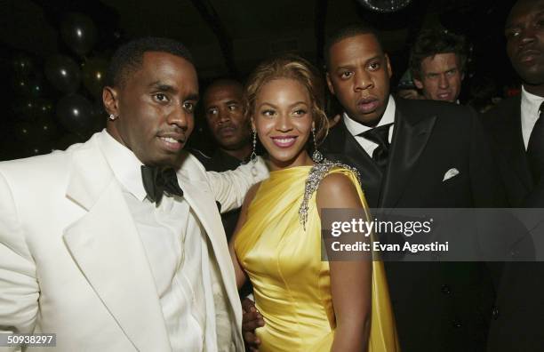 Sean "P. Diddy" Combs and singers Beyonce Knowles and Jay-Z attend the Sean Jean/Zac Posen CFDA after-party at Marquee, on June 7, 2004 in New York...
