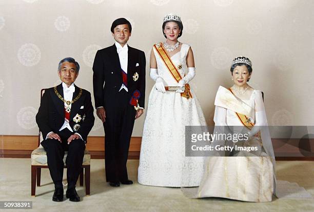 In this handout photo from the Imperial Household Agency, Crown Prince Naruhito of Japan and his wife Crown Princess Masako pose with Emperor Akihito...