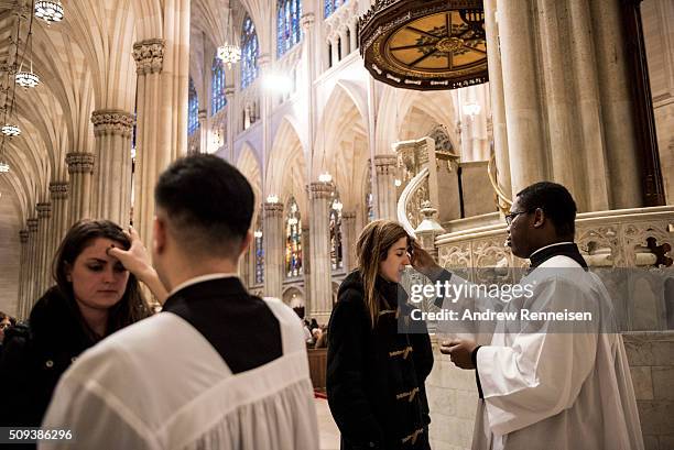 Catholics receive ashes on Ash Wednesday at St. Patrick's Cathedral on February 10, 2016 in New York City. The day marks the start of the lent for...