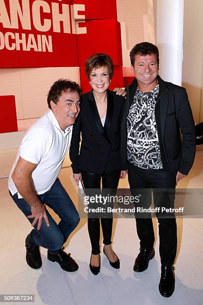 Catherine Laborde standing between Humorists 'Les Chevaliers du fiel' Francis Ginibre and Eric Carriere attend the 'Vivement Dimanche' French TV Show...