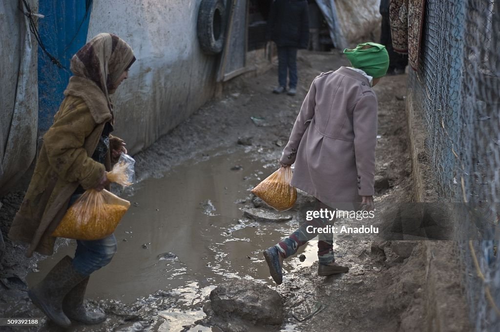 ALEPPO, SYRIA - FEBRUARY 10: Syrian children, who fled bombing in Aleppo, are seen at a tent city close to the Bab al-Salam border crossing on Turkish-Syrian border near Azaz town of Aleppo, Syria on February 10, 2016. Russian airstrikes have recently forced some 40,000 people to flee their homes in Syrias northern city of Aleppo. (Photo by Kerem Kocalar/Anadolu Agency/Getty Images)