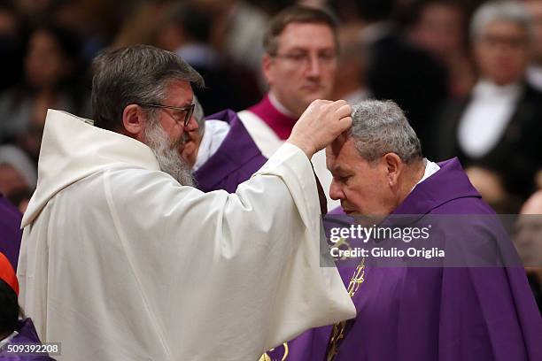 Priests attend Ash Wednesday Mass at St. Peter's Basilica on February 10, 2016 in Vatican City, Vatican. Ash Wednesday opens the liturgical 40 day...