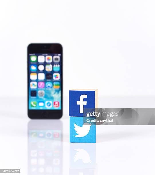 social media logos with iphone5 - google social networking service stock pictures, royalty-free photos & images