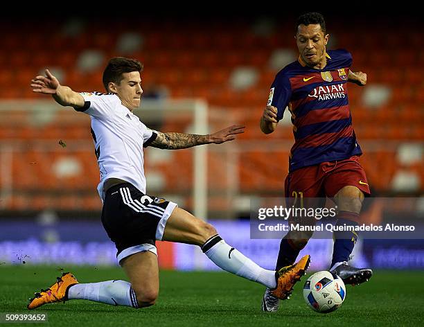 Adriano of Barcelona is tackled by Santi Mina of Valencia during the Copa del Rey Semi Final, second leg match between Valencia CF and FC Barcelona...