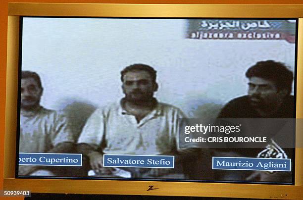 Projected on a screen during a press conference, from left to right: Umberto Cupertino Salvatore Stefio and Maurizio Agliana are seen as Polish...