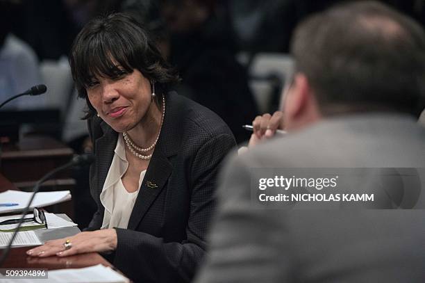 Flint mayor Karen Weaver speaks with other panelists during a break in a House Democratic Steering and Policy Committee hearing on the Flint,...