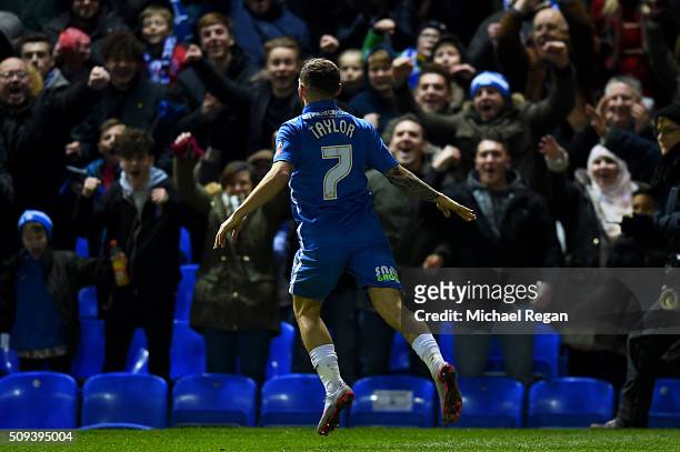 Jon Taylor of Peterborough celebrates after scoring the opening goal during the Emirates FA Cup fourth round replay match between Peterborough United...