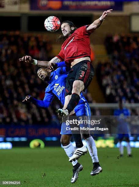 Shaq Coulthirst of Peterborough jumps for the ball with Jonas Olsson of West Bromwich Albion during the Emirates FA Cup fourth round replay match...