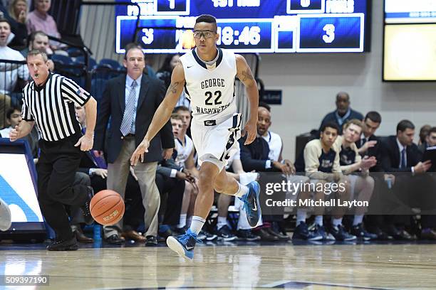 Joe McDonald of the George Washington Colonials dribbles up court during a college basketball game against the Davidson Wildcats at the Smith Center...