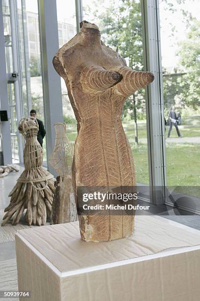 Bread dress sculpture is pictured at the opening of an exhibition sponsored by the Foundation Cartier pour l'Art Contemporain on June 5, 2004 in...