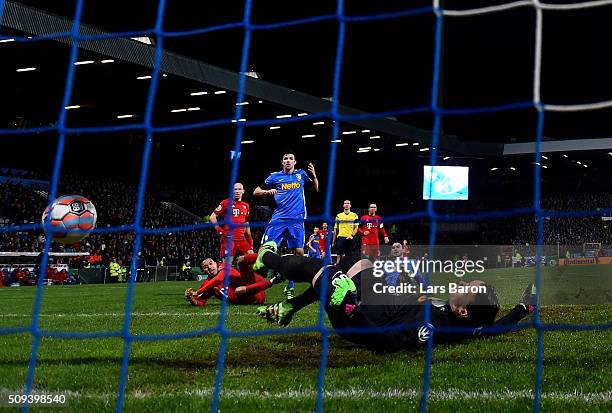 Thiago of Muenchen scores his teams second goal during the DFB Cup Quarter Final match between VfL Bochum and Bayern Muenchen at Rewirpower Stadium...