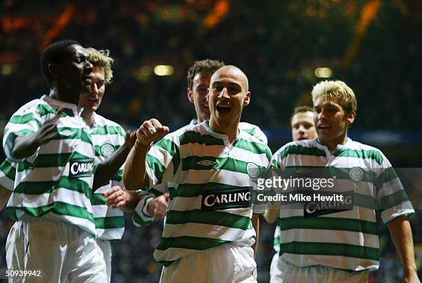 Two goal hero Henrik Larsson of Celtic is congratulated by team-mates after scoring his second goal during the UEFA Cup match between Celtic and FK...