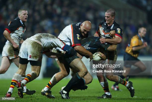 Luke Rooney of Penrith is wrapped up by the Bradford defence during the World Club Challenge match between Bradford Bulls and Penrith Panthers at the...