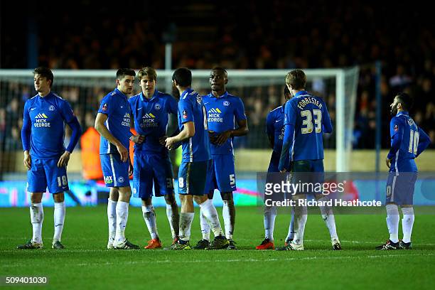 Peterborough players reacts during the penalty shootout in the Emirates FA Cup fourth round replay match between Peterborough United and West...