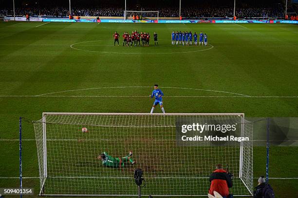 Lee Angol of Peterborough watches as his penalty is saved by Ben Foster of West Bromwich Albion during the penalty shootout in the Emirates FA Cup...