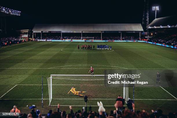 James Chester of West Bromwich Albion scores a penalty past Ben Alnwick of Peterborough during the penalty shootout in the Emirates FA Cup fourth...