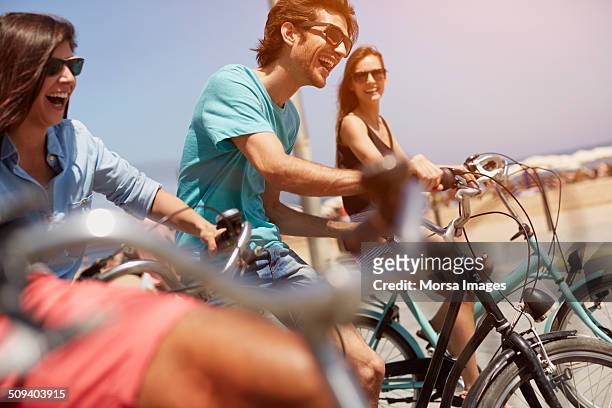 friends riding bicycles together - cycling group stock-fotos und bilder